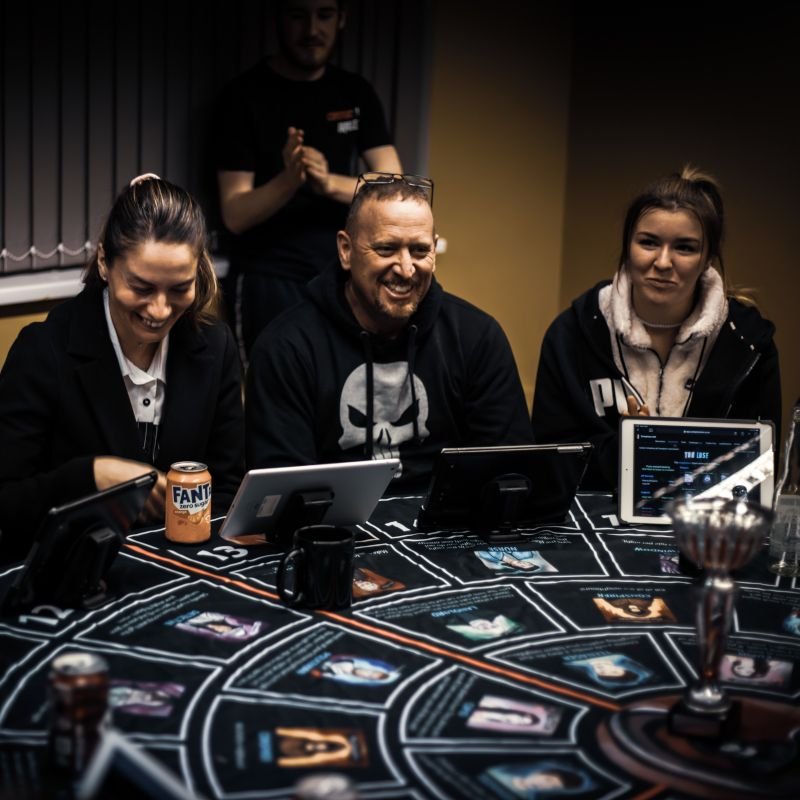 A group of players playing Conspiracy LIVE at the Good Companion
