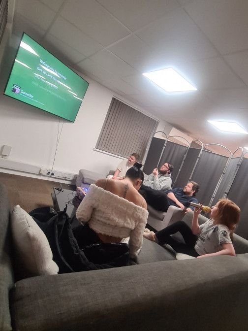 Playground's lounge area featuring a 65inch TV